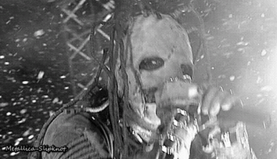 Man In Mask Singing Into Microphone GIF