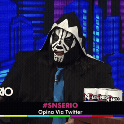 Man In Mask Sitting In Front Of #Snserio Sign GIF