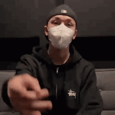 Man In Mask Sitting On Couch GIF