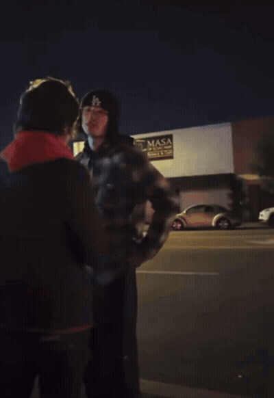 Man In Mask Standing Before Masa Building GIF
