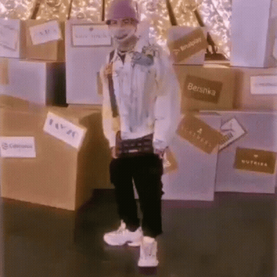 Man In Mask Standing In Front Of Boxes GIF