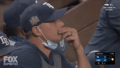 Man In Mask Watching Fox Deportes Baseball GIF