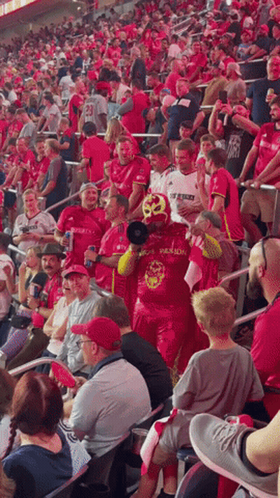 Man in Mask Wearing Phoenix Shirt in Crowd