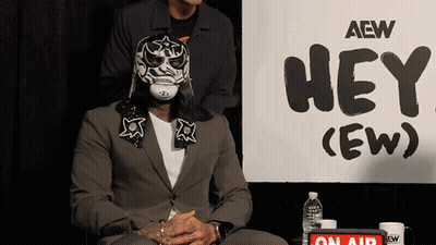 Man In Mask With Sign Hey (Ew) GIF