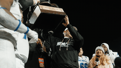 Man In Memphis Football Shirt Holding Trophy GIF