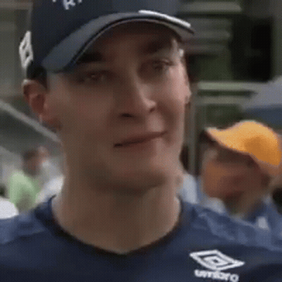 Man In Mercedes Shirt With Sign 44 GIF
