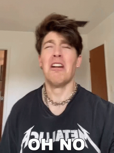 Man In Metallica Shirt Making Sad Face GIF