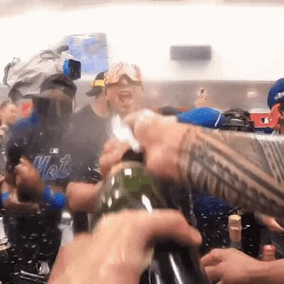 Man In Mets Shirt Opening Bottle GIF