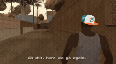 Man In Miami Dolphins Hat Walking Down Street GIF