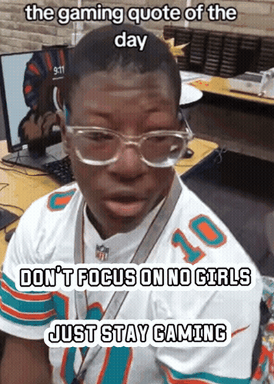 Man In Miami Dolphins Jersey At Desk GIF