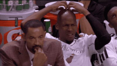 Man In Miami Heat Jersey Sitting In Stands GIF