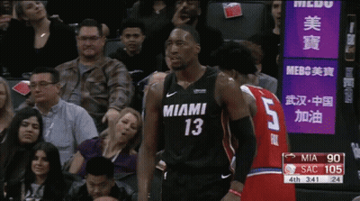 Man In Miami Jersey Beside Man In Red Jersey GIF