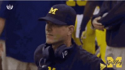 Man In Michigan Hat And Headphones GIF