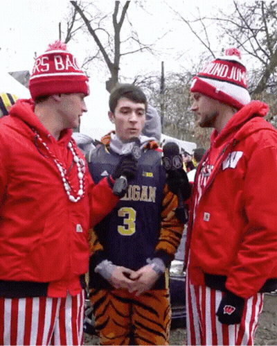 Man In Michigan Jersey Being Interviewed GIF