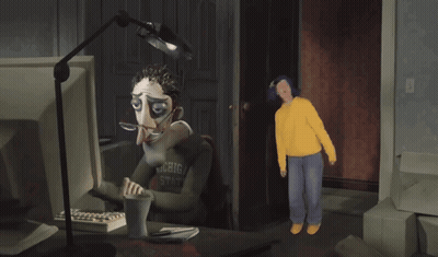 Man In Michigan State Shirt Looking At Computer GIF