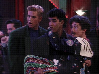 Man In Mickey Mouse Jacket Holding Another Man GIF