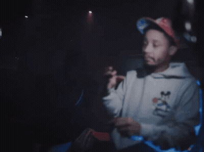 Man In Mickey Mouse Sweatshirt Pointing At Gun Saying I Got The On Me Right Now GIF
