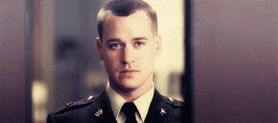 Man In Military Uniform And Tie Looking At Camera GIF