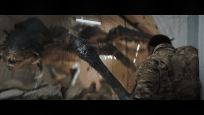 Man In Military Uniform Facing Crawling Monster GIF
