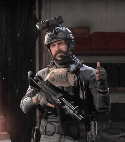 Man In Military Uniform Holding Gun And Thumbs Up GIF
