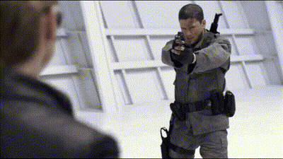 Man In Military Uniform Holding Gun GIF