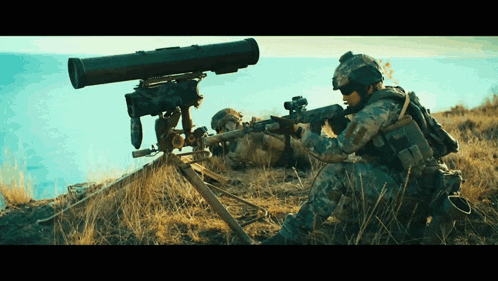 Man In Military Uniform Holding Gun Looking Through Telescope GIF