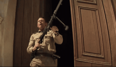 Man In Military Uniform Holding Gun GIF