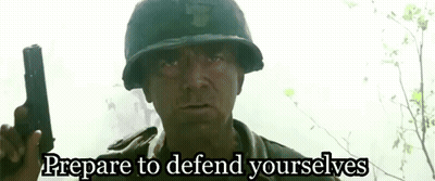 Man in Military Uniform Holding Gun Says Prepare to Defend Yourselfs