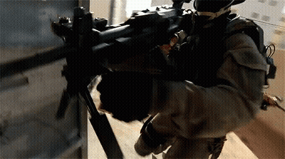 Man In Military Uniform Holding Rifle GIF