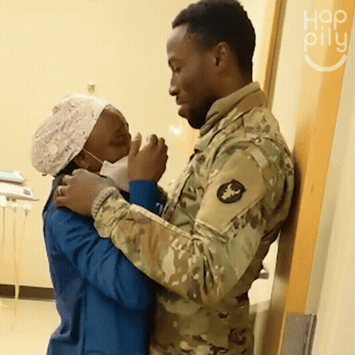 Man In Military Uniform Hugging Nurse GIF