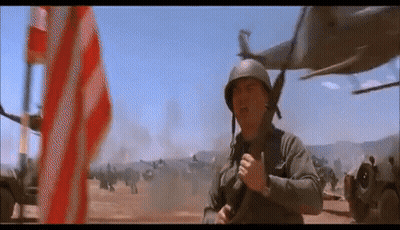 Man In Military Uniform In Front Of American Flag GIF
