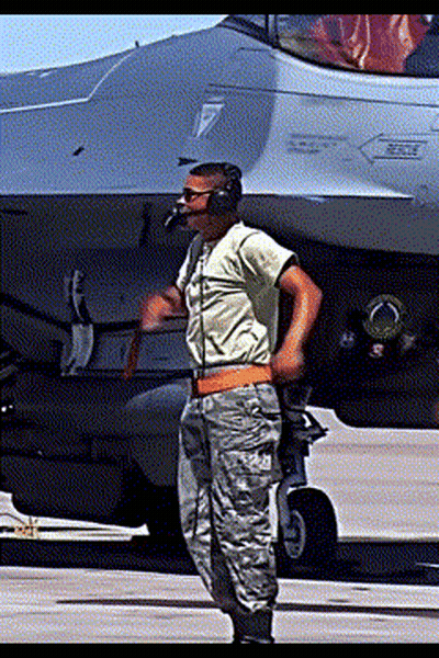 Man In Military Uniform In Front Of Fighter Jet With Rescue GIF