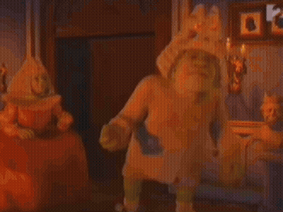Man In Military Uniform Kneeling Beside Man Lying On Ground GIF
