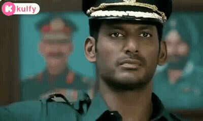 Man In Military Uniform Looking At Camera GIF