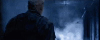 Man In Military Uniform Looking In Dark Room GIF