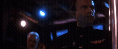 Man In Military Uniform Looking In Dark Room GIF