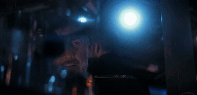 Man In Military Uniform On Boat Looking At Camera GIF