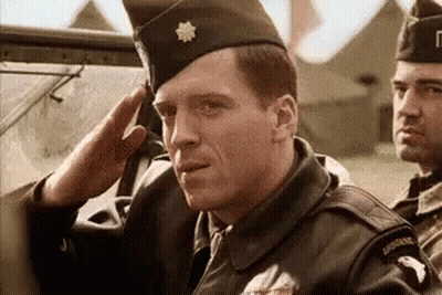 Man In Military Uniform Saluting In Car GIF