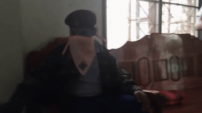 Man In Military Uniform Sitting By Window GIF