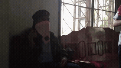 Man In Military Uniform Sitting By Window GIF