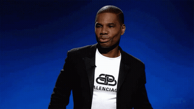 Man In Military Uniform Sitting With BET Logo GIF