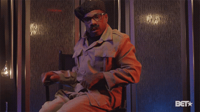 Man In Military Uniform Sitting With BET Logo GIF