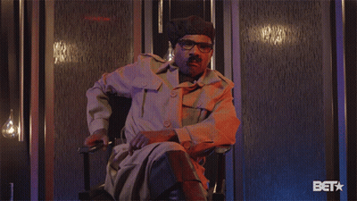 Man In Military Uniform Sitting With BET Logo GIF