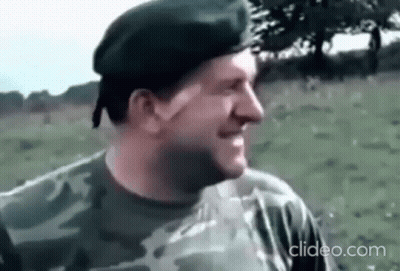 Man In Military Uniform Smiling In Field With Beret GIF