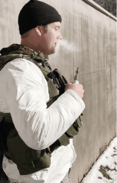 Man In Military Uniform Smoking Pipe GIF