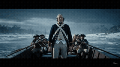 Man In Military Uniform Standing In Boat GIF