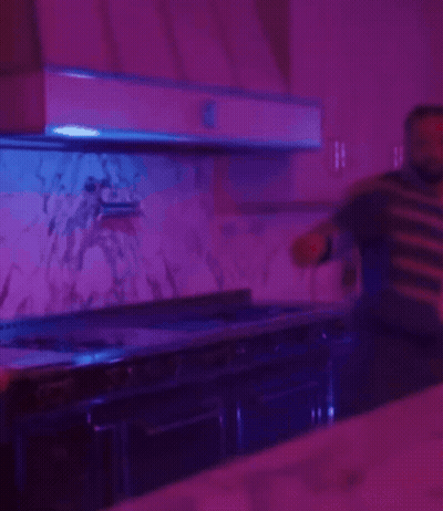 Man In Military Uniform Standing In Kitchen GIF