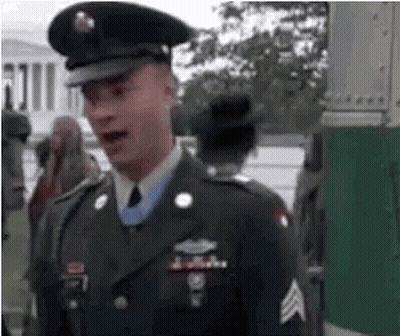 Man In Military Uniform Talking In Front Of White House GIF