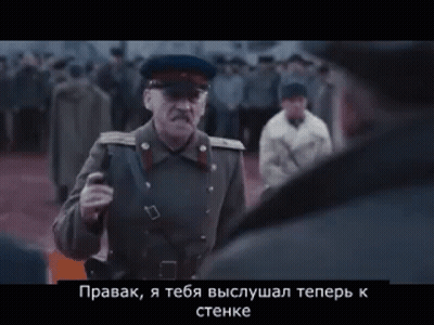 Man In Military Uniform Talking To Another In Crowd GIF