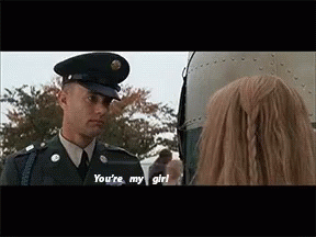 Man In Military Uniform Talking To Woman In Front Of Plane GIF